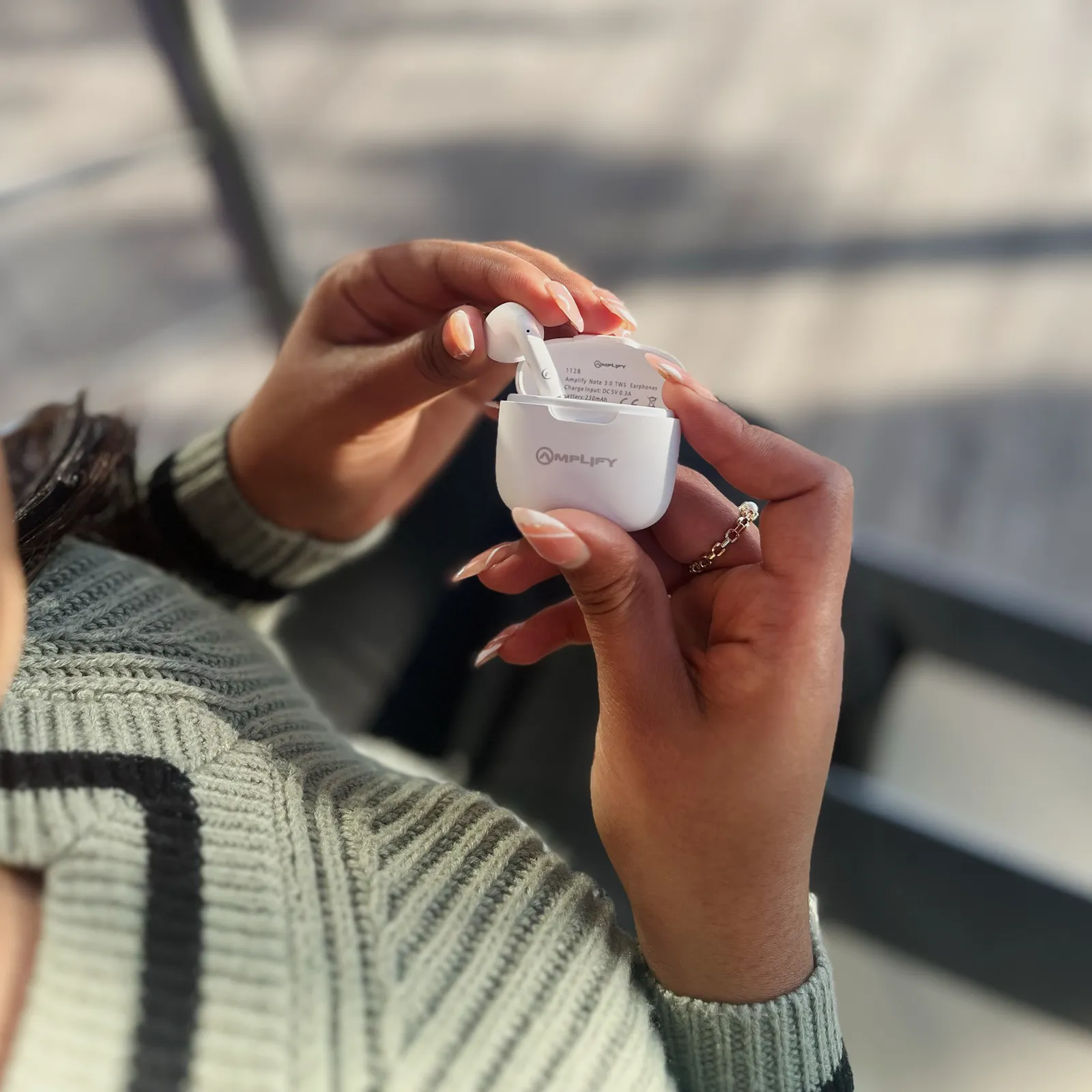 Amplify wireless earphones in use